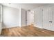 A spacious bedroom featuring hardwood floors, neutral walls, and white trim throughout the room at 100 Regina Ct, Fayetteville, GA 30215