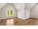 Well-lit bedroom with hardwood floors, a large window, and clean white walls at 100 Regina Ct, Fayetteville, GA 30215