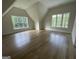 Bright bedroom with two windows and hardwood floors at 100 Regina Ct, Fayetteville, GA 30215