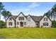 Beautiful light brick two story home with a manicured lawn and a symmetrical design at 100 Regina Ct, Fayetteville, GA 30215