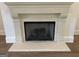 Close-up of the fireplace, showcasing the stone mantel and tile hearth at 100 Regina Ct, Fayetteville, GA 30215
