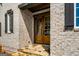Close-up of the double front door with light brick and stone step details at 100 Regina Ct, Fayetteville, GA 30215