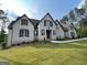 Beautiful two-story home featuring well-manicured lawn and inviting entrance at 100 Regina Ct, Fayetteville, GA 30215