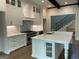 Bright kitchen featuring a large island, stainless steel appliances, and custom white cabinets at 100 Regina Ct, Fayetteville, GA 30215