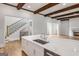 Kitchen with an island, a staircase, and stainless steel appliances at 100 Regina Ct, Fayetteville, GA 30215