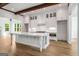 A kitchen island with a white countertop, modern appliances and hardwood flooring at 100 Regina Ct, Fayetteville, GA 30215