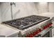 Close-up of a range featuring a pot filler and a sleek stainless steel design at 100 Regina Ct, Fayetteville, GA 30215