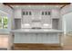 Spacious kitchen featuring a large island with ample cabinet space and countertop at 100 Regina Ct, Fayetteville, GA 30215