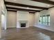 Bright and spacious living room featuring hardwood floors, modern fireplace, and natural light at 100 Regina Ct, Fayetteville, GA 30215