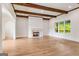 Spacious living room features hardwood floors, a fireplace and white trim at 100 Regina Ct, Fayetteville, GA 30215