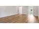 Main bedroom with hardwood floors and ensuite bathroom entrance at 100 Regina Ct, Fayetteville, GA 30215