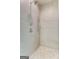Modern shower featuring dual shower heads and elegant, neutral-toned tiling at 100 Regina Ct, Fayetteville, GA 30215