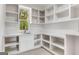 Bright utility room with ample shelving, a sink, and counter space, perfect for organization at 100 Regina Ct, Fayetteville, GA 30215