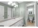 Charming bathroom featuring vanity, mirror, lighting and a view of the toilet/tub space at 810 Bedford Park, Peachtree City, GA 30269