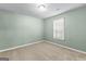 Well-lit bedroom featuring carpet, a window, and neutral paint at 810 Bedford Park, Peachtree City, GA 30269