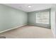 Cozy bedroom with neutral carpet and a bright window at 810 Bedford Park, Peachtree City, GA 30269