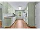 The kitchen features tiled backsplash, granite countertops and stainless steel appliances at 810 Bedford Park, Peachtree City, GA 30269