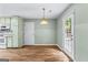 Kitchenette area featuring a door to the exterior, cabinets, and modern appliances at 810 Bedford Park, Peachtree City, GA 30269