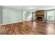 Spacious living room with wood floors and a stone fireplace at 810 Bedford Park, Peachtree City, GA 30269