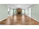 Living room featuring wood flooring and stone fireplace with mantel, and light green paint at 810 Bedford Park, Peachtree City, GA 30269