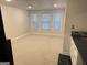 A finished basement featuring new carpet, recessed lighting, and a convenient wet bar at 107 Terrane Rdg, Peachtree City, GA 30269