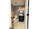 Stylish powder room featuring modern fixtures, decorative vanity, and neutral tile flooring at 107 Terrane Rdg, Peachtree City, GA 30269