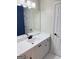 Bathroom vanity with white marble top, a large mirror, and black hardware at 107 Terrane Rdg, Peachtree City, GA 30269