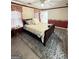 Traditional bedroom featuring a sleigh bed, decorative rug, and soft, natural lighting at 107 Terrane Rdg, Peachtree City, GA 30269