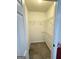 Walk-in closet with ventilated shelving and tiled flooring, ready for organized storage at 107 Terrane Rdg, Peachtree City, GA 30269