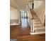 Welcoming foyer with hardwood floors, a staircase, and views into the adjacent living spaces at 107 Terrane Rdg, Peachtree City, GA 30269