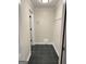 Hallway area complete with black tile flooring and built-in storage at 107 Terrane Rdg, Peachtree City, GA 30269