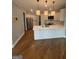 Modern kitchen with an island, stainless steel appliances, pendant lighting, and a sleek design at 107 Terrane Rdg, Peachtree City, GA 30269