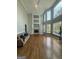 Spacious living room featuring a fireplace, hardwood floors, and large windows with scenic outdoor views at 107 Terrane Rdg, Peachtree City, GA 30269