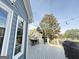 Cozy outdoor deck with a dining table, grill, and scenic views, perfect for relaxation and entertaining at 107 Terrane Rdg, Peachtree City, GA 30269