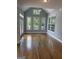 Inviting sun room with hardwood floors, bright windows and a ceiling fan offering natural light at 107 Terrane Rdg, Peachtree City, GA 30269