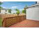 A brown wooden back deck features lattice-patterned railings overlooking the yard and neighboring houses at 2049 Charter Ln, Lithonia, GA 30058