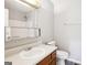 A functional bathroom features a white sink, medicine cabinet and toilet at 2049 Charter Ln, Lithonia, GA 30058