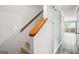 Hallway with luxury vinyl plank flooring and stairs with wood railing at 2049 Charter Ln, Lithonia, GA 30058