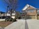 Charming brick townhome featuring an attached two-car garage and well-maintained landscaping at 2540 Willow Grove Road Nw Rd # 15, Acworth, GA 30101