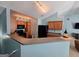 Open-concept kitchen featuring wood cabinets, black appliances and a breakfast bar at 2540 Willow Grove Road Nw Rd # 15, Acworth, GA 30101