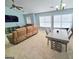 This open living area features a dining table and ample seating near large, bright windows at 2540 Willow Grove Road Nw Rd # 15, Acworth, GA 30101