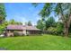 Expansive backyard with a well-maintained lawn and mature trees providing shade at 2624 Windridge Dr, Acworth, GA 30102