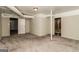 Spacious basement area offering neutral carpeting and access to other rooms at 2624 Windridge Dr, Acworth, GA 30102