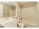 Clean bathroom with tiled shower, tub and white vanity at 2624 Windridge Dr, Acworth, GA 30102