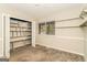 Cozy bedroom featuring a large closet with custom shelving and natural light at 2624 Windridge Dr, Acworth, GA 30102