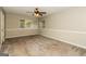 Bedroom with neutral paint, carpeting, and natural light from the large window at 2624 Windridge Dr, Acworth, GA 30102
