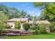 Charming home with lush landscaping, a retaining wall, and a well-maintained lawn at 2624 Windridge Dr, Acworth, GA 30102