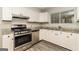 Well-equipped kitchen with stainless steel appliances and ample counter space at 2624 Windridge Dr, Acworth, GA 30102