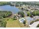 Aerial view of the community featuring a lake, pool, tennis courts, and clubhouse at 165 Lakeside Pt, Covington, GA 30016