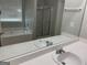 Bright bathroom features a soaking tub and double sinks at 165 Lakeside Pt, Covington, GA 30016